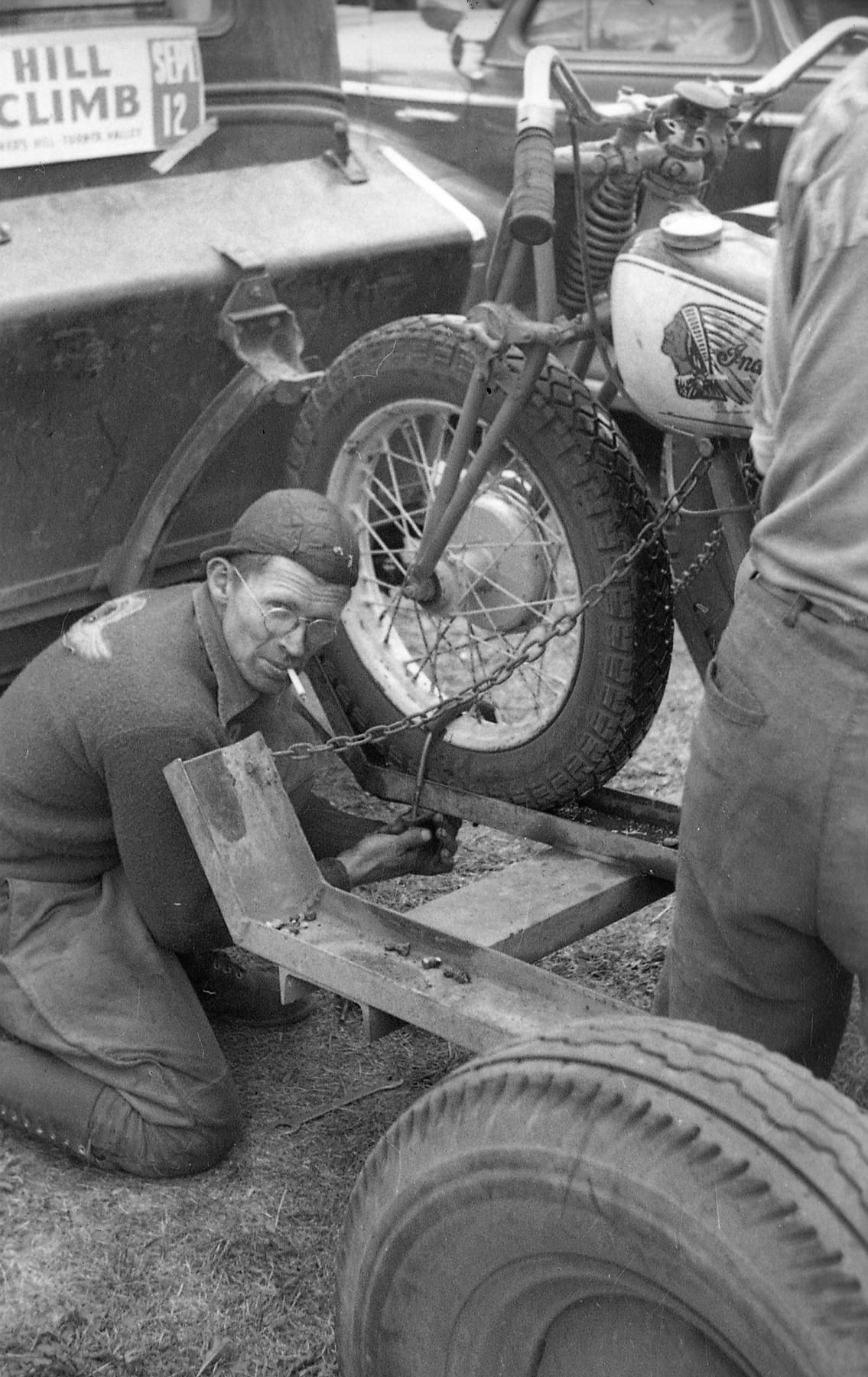 Walt Healy wrenching on his Indian at the Turner Valley hill climb